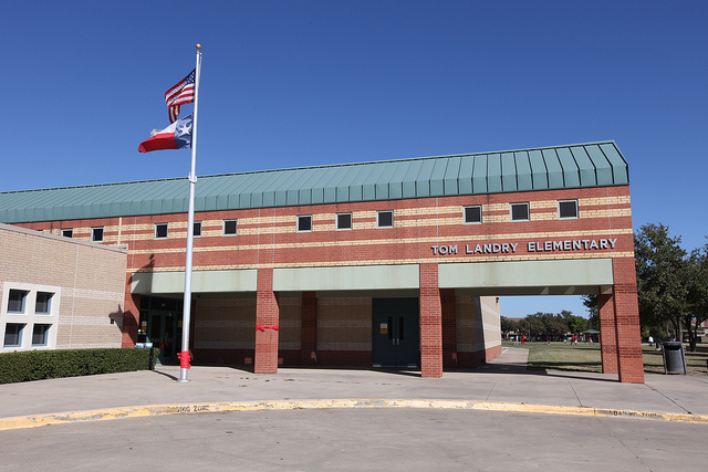 front of Landry Elementary with flag pole in front.