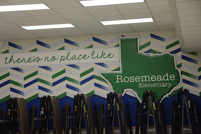 a mural on the wall with white, green, and blue designs that say there's no place like Rosemeade Elementary
