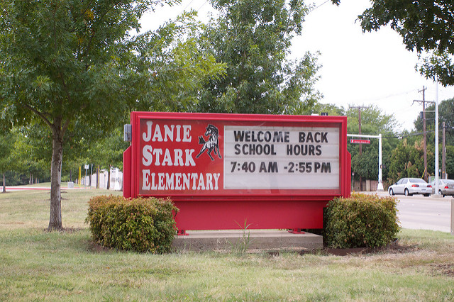 Stark Elementary sign in front of school that says Welcome Back, School Hours are 7:40 A M to 2:55 P M 
