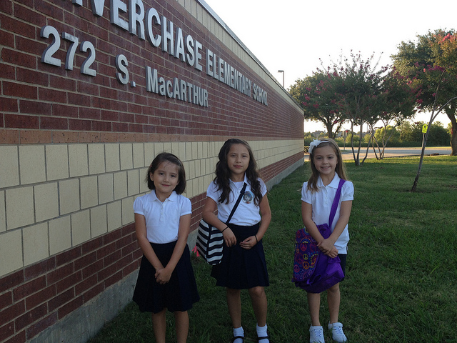 three students standing in front of Riverchase Elementary