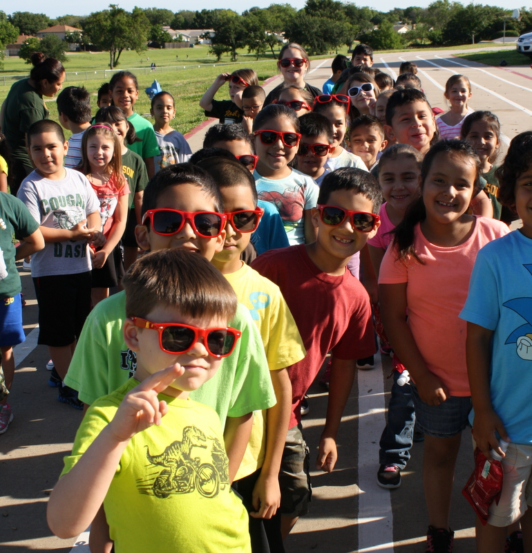 Group of students with glasses on smiling