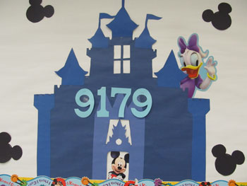 A poster of a castle with mickey mouse in it that has a number of 9179 on it