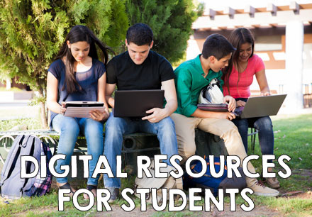 digital resources for students, a group of students on their laptops outside.