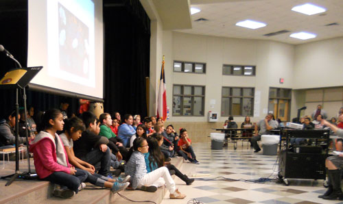 12 students from Blanton elementary presenting and reading the underground railroad aloud to an audience