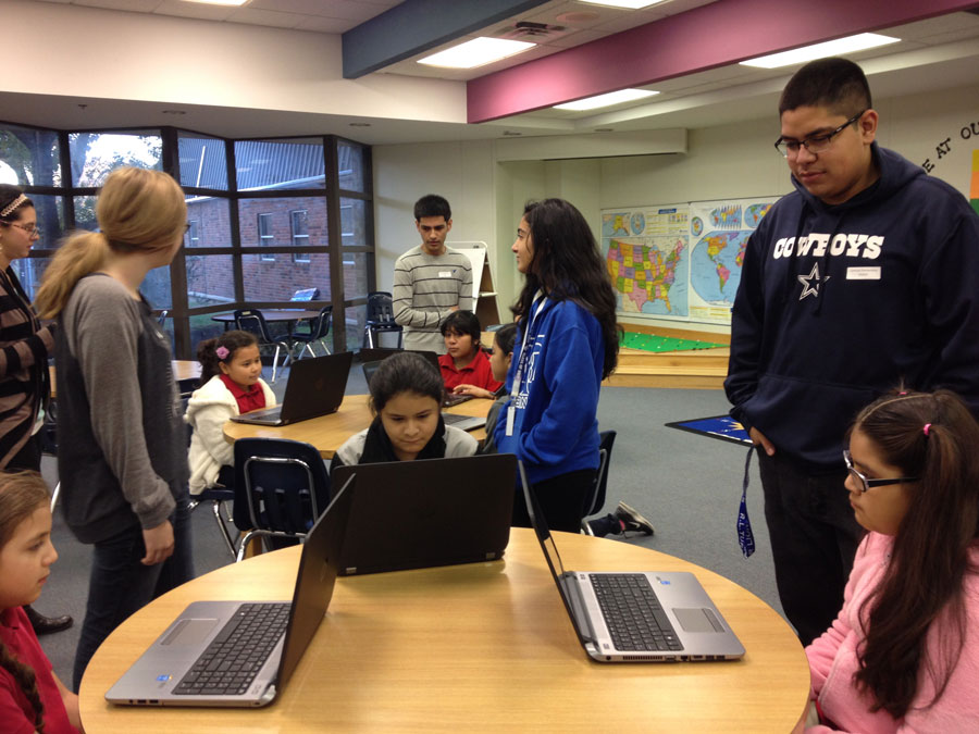 Students from Turner High School collaborating with central students for hour of coding.