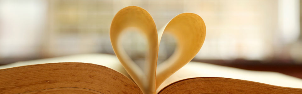 book with pages folded inward in the shape of a heart