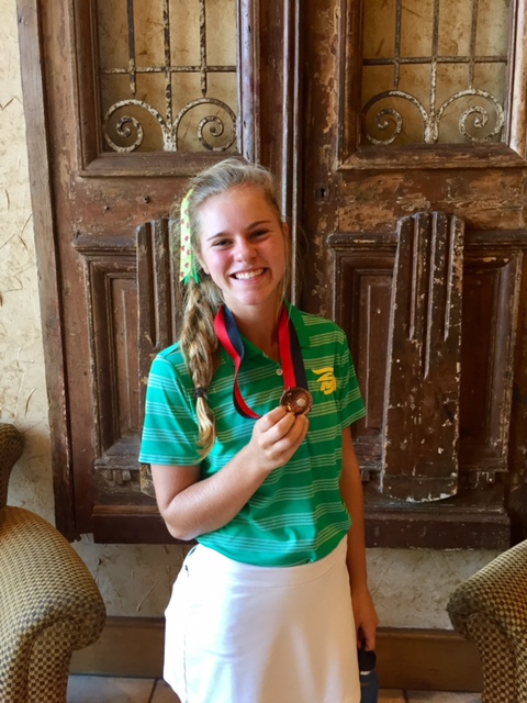 Trojan Golfer, Casey Wahmon, with her 3rd place medal