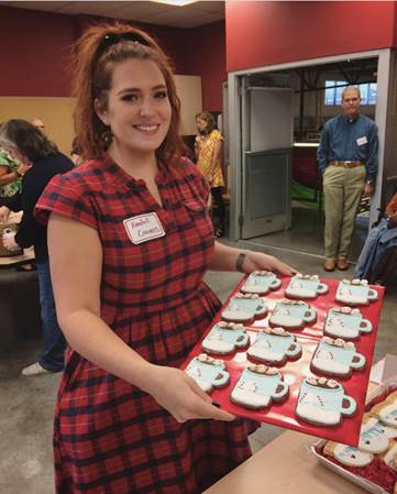 Riverchase Art Teacher, Kendall Cravens holding her first place cookies for the Dallas Morning news Annual Cookie Contest.