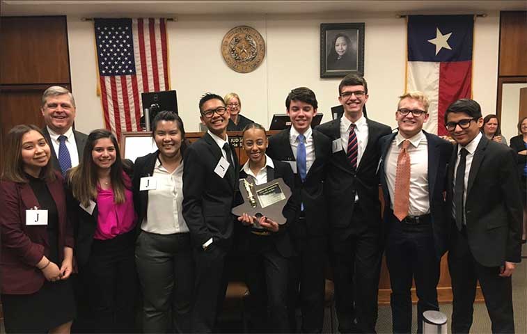 Creekview mock trial team holds trophy from their win