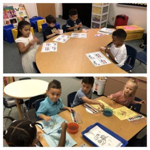 Students at a table practicing math skills