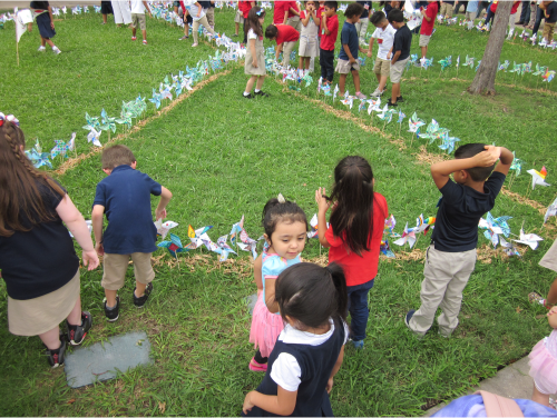 Blair Elementary Students Putting Pinwheels on the Ground