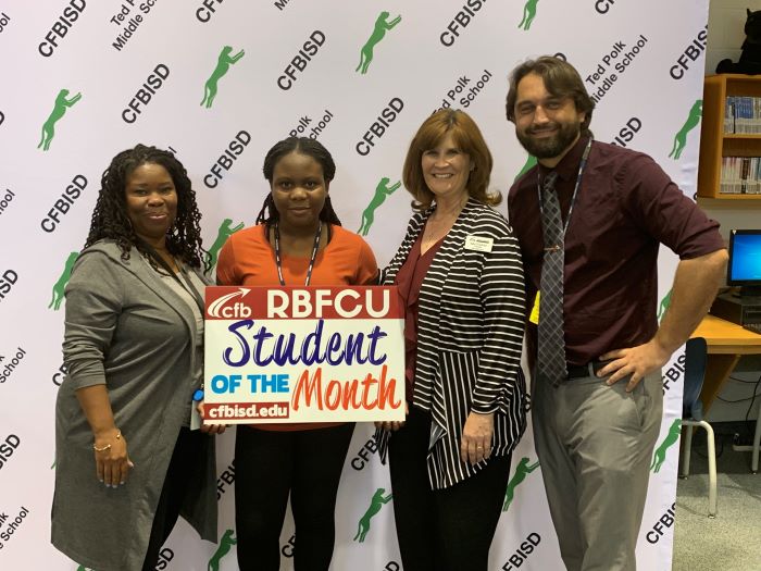 Student of the Month at CFBISD with the Principal of Polk Middle School and staff members